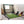 The Net Return Pro Turf Mat in de garage met golfclubs, golftassen en een net van The Net return. 